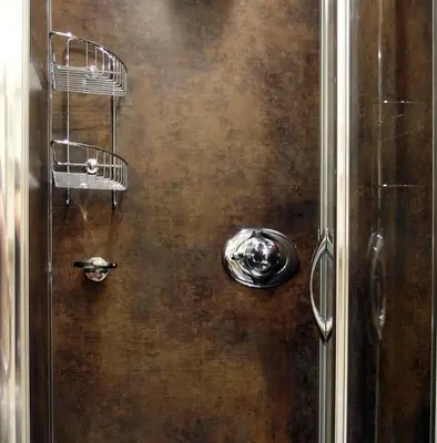 a shower with a metal door with a towel at Avondale Guest House in Keswick