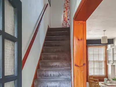 a staircase in a house with a stair case at Market Place in Workington