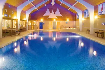 a large swimming pool in a hotel room at Brae Fell Cottage, Sebergham, Nr Caldbeck dog friendly and hot tub in Sebergham