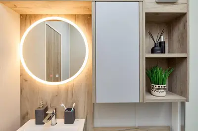 a bathroom with a white sink and a mirror at Elite Holiday Caravan in Bassenthwaite