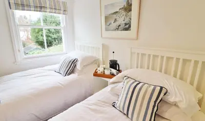 two beds sitting next to each other in a bedroom at 14 Union Street in Kirkcudbright