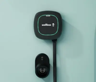 a car charger with a cell phone plugged in at The Capsule Room at The Lairbeck in Keswick in Keswick
