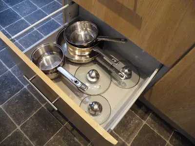 a stove with three pots and pans on it at Family Home Near City Centre - New KING bed! in Carlisle