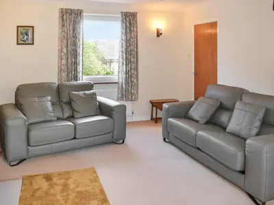 a living room with two couches and a couch at Rivendell in Burgh by Sands