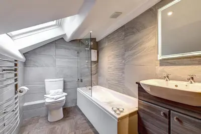 a bathroom with a sink and a toilet and a tub at 2 Bed in Elterwater oc-gl004 in Chapel Stile
