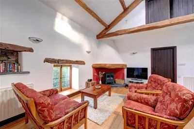 a living room with two couches and a fireplace at 2 Bed in Grasmere oc-gl007 in Grasmere
