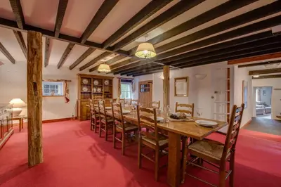 a dining room with a wooden table and chairs at 5 Bed in Grasmere oc-gl008 in Grasmere