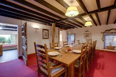 a dining room with a wooden table and chairs at 5 Bed in Grasmere oc-gl008 in Grasmere