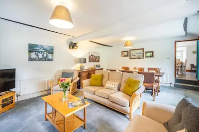 a living room with couches and a tv at 3 Bed in Elterwater oc-gl011 in Chapel Stile