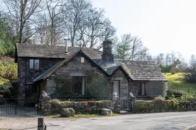 an old stone house on the side of a road at 2 Bed in Grasmere oc-gl081 in Grasmere
