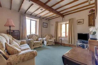 a living room with a couch and chairs and a tv at 2 Bed in Grasmere oc-gl081 in Grasmere