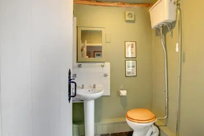 a bathroom with a toilet and a sink at 3 Bed in Little Langdale oc-gl102 in Little Langdale