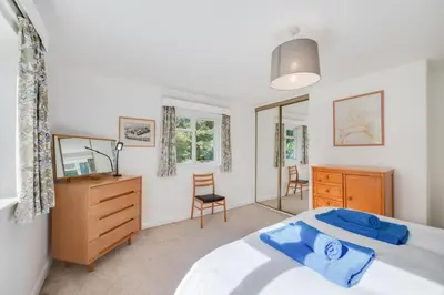 a bedroom with a bed and a desk and a chair at 3 Bed in Grasmere oc-ld181 in Grasmere