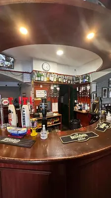 a bar in a restaurant with a counter top at The Bruce Hotel in Newton Stewart