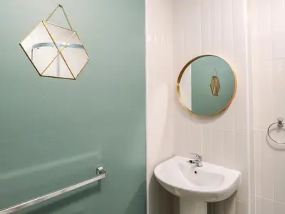 a bathroom with a sink and a mirror at 8A Corkickle in Whitehaven