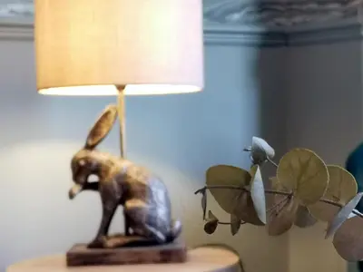 a bronze elephant statue sitting on top of a lamp at Squirrel Lodge in Keswick