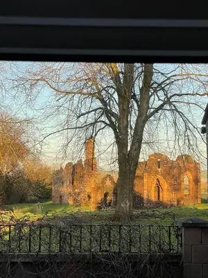 a view of a castle from a window at Lovely 2 bed apartment with hot tub log burner and off street parking in Dumfries