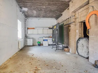 an empty room in a building with a large window at Galena in Glenridding