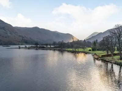 a view of a river with mountains in the background at Galena in Glenridding