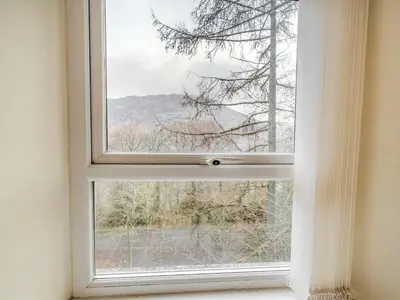 a window with a view of a mountain at Galena in Glenridding
