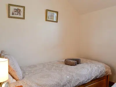 a bedroom with a bed with a pillow on it at Inglewood - 15288 in Keswick