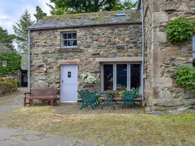 a stone building with four chairs and a bench at Lowther - Np2801 in Dockray