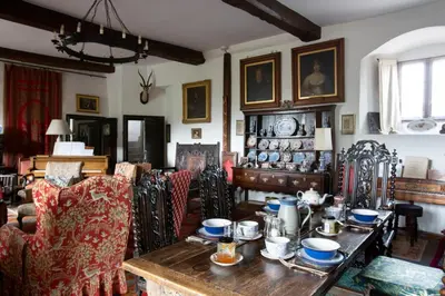 a living room with a wooden table and chairs at Johnby Hall in Penrith