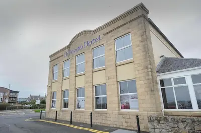 a brick building with a sign on the side of it at Horizon Hotel in Ayr