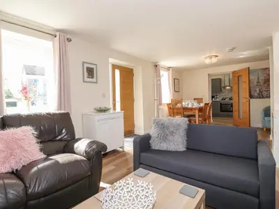 a living room with a couch and a table at The Granary in Wigton
