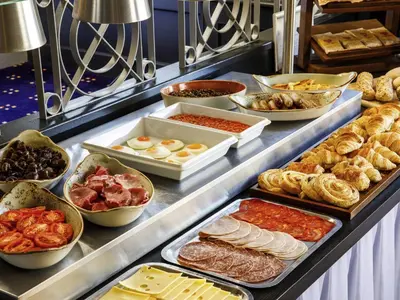 a buffet line with different types of food on it at Mercure Ayr Hotel in Ayr