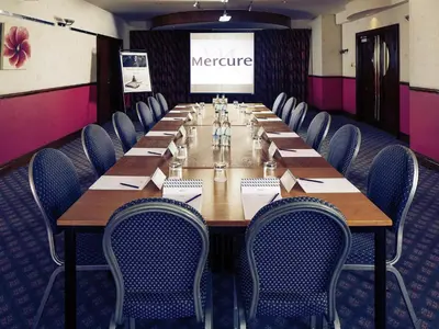 a conference room with a long table and chairs at Mercure Ayr Hotel in Ayr