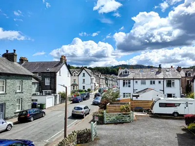 a view of a small town with cars parked on the street at The Paddock in Keswick