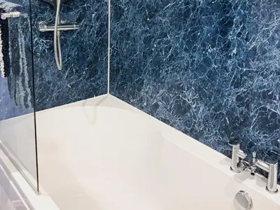 a bathroom with a shower and a sink at Driftwood in Mainsriddle