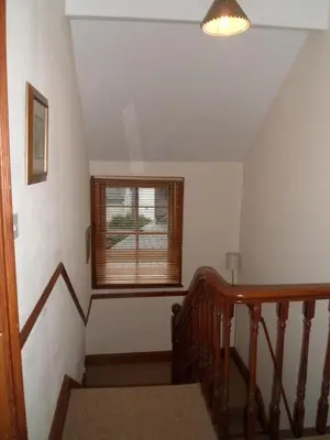 a staircase in a house with a window at Oak Lodge in Keswick