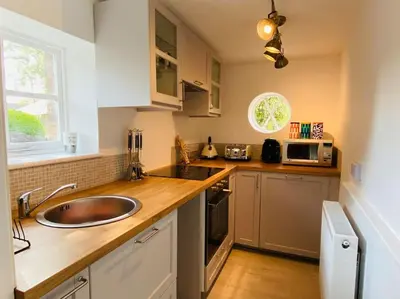 a kitchen with a sink and a counter top at Unique Country Estate nr Mountains & Beach in Silloth