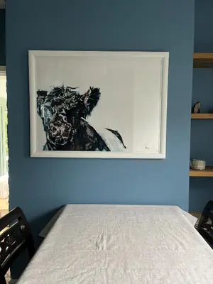 a painting of a horse on a blue wall at Apple Cottage in Wigtown