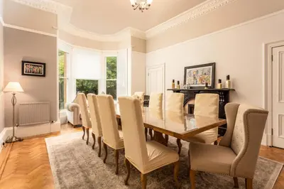 a dining room with a table and chairs at Burnock Lodge with Hot Tub in Ayr