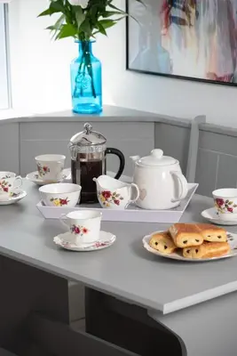 a table with cookies and tea cups on it at Cottage - Sleeps 4 hot tub & pet friendly in Carlisle