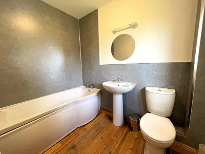 a bathroom with a sink and a toilet and a bath tub at Spectacular 7BR House Hot Tub and Gardens in Gretna - Pass the Keys in Gretna Green