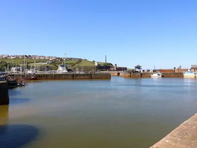 a view of a river with boats in it at Harbourside Apartment - 1 Bedroom - Sleeps 2 in Whitehaven
