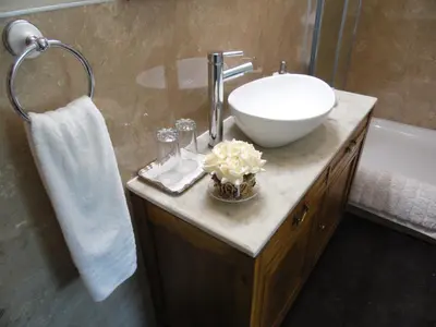 a bathroom with a sink and a white bowl at The Haven B&B in Castle Douglas