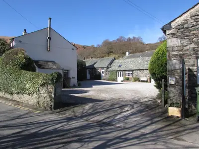 a street in a small village with buildings at cottage 7 old farmhouse mews in Keswick