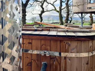 a wooden box with wooden sticks on top of it at The Treehouse Caerlaverock - Uk45028 in Carsethorn