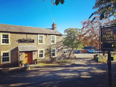 a building with a sign in front of it at The Plough Inn in Carlisle