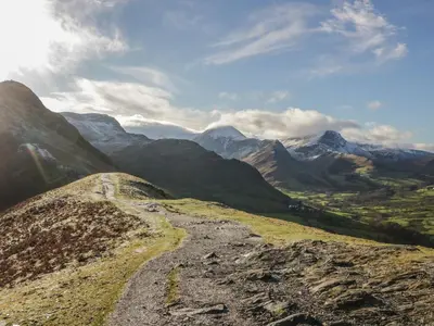 a dirt road on a mountain with mountains in the background at Canadian Cabin 37 in Keswick