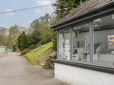 a shop with a window on the side of a road at Canadian Cabin No 38 in Keswick