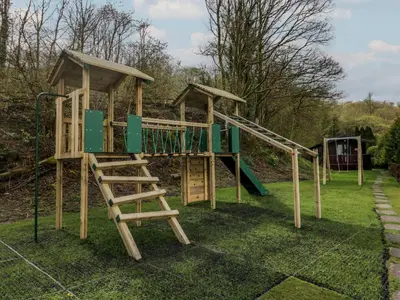 a playground with a slide and a ladder at Pod No 5 in Keswick
