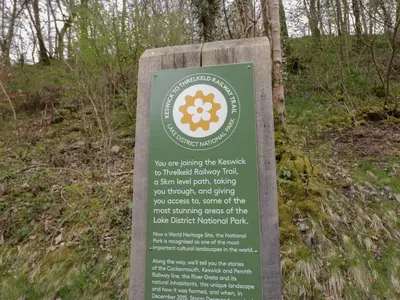a sign for a hiking trail in the woods at Pod No 5 in Keswick