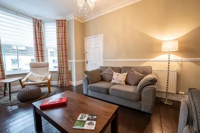 a living room with a couch and a table at 25 Church Street in Keswick