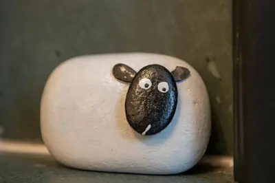 a white vase with a picture of a sheep on it at 25 Church Street in Keswick